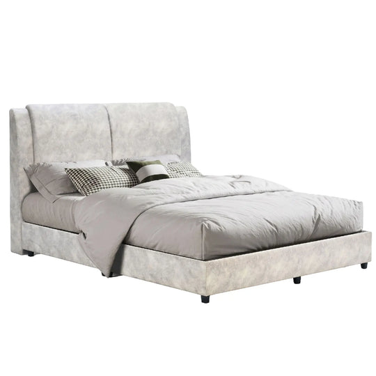 Gray upholstered bed with bedding on a white background