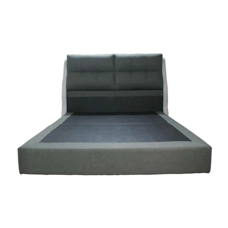 Gray upholstered bed with tufted headboard on a white background