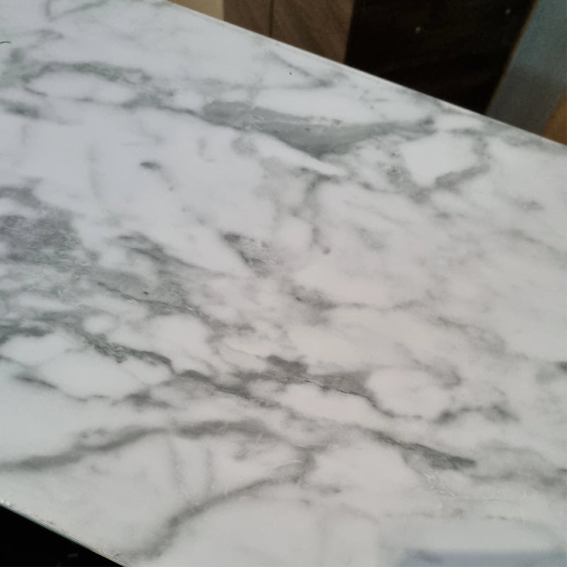 Close-up of a marble countertop with gray and white patterns.