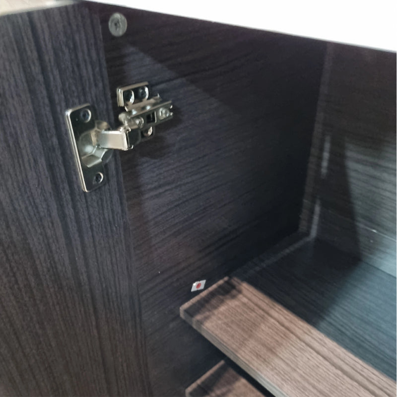 Close-up of a wooden cabinet with a hinge