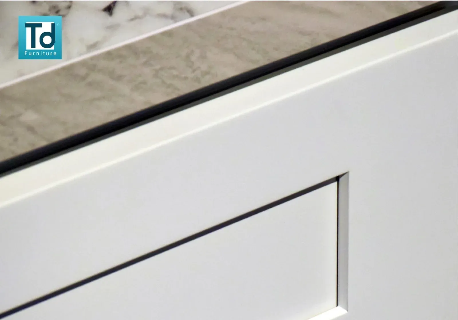 Close-up of a white Shaker door showing the five-piece frame and recessed centre panel