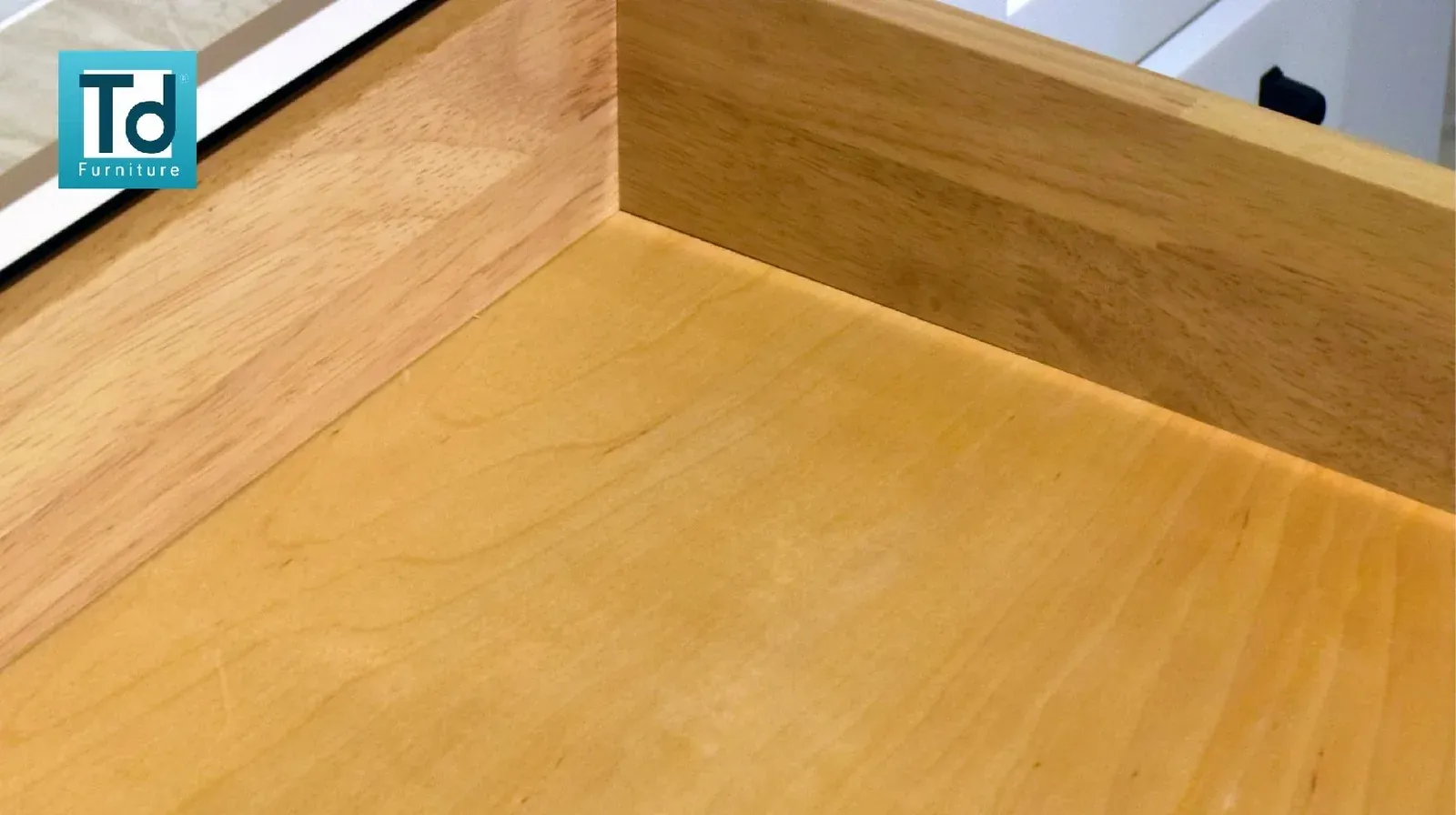 Wood veneer surface inside a cabinet drawer box