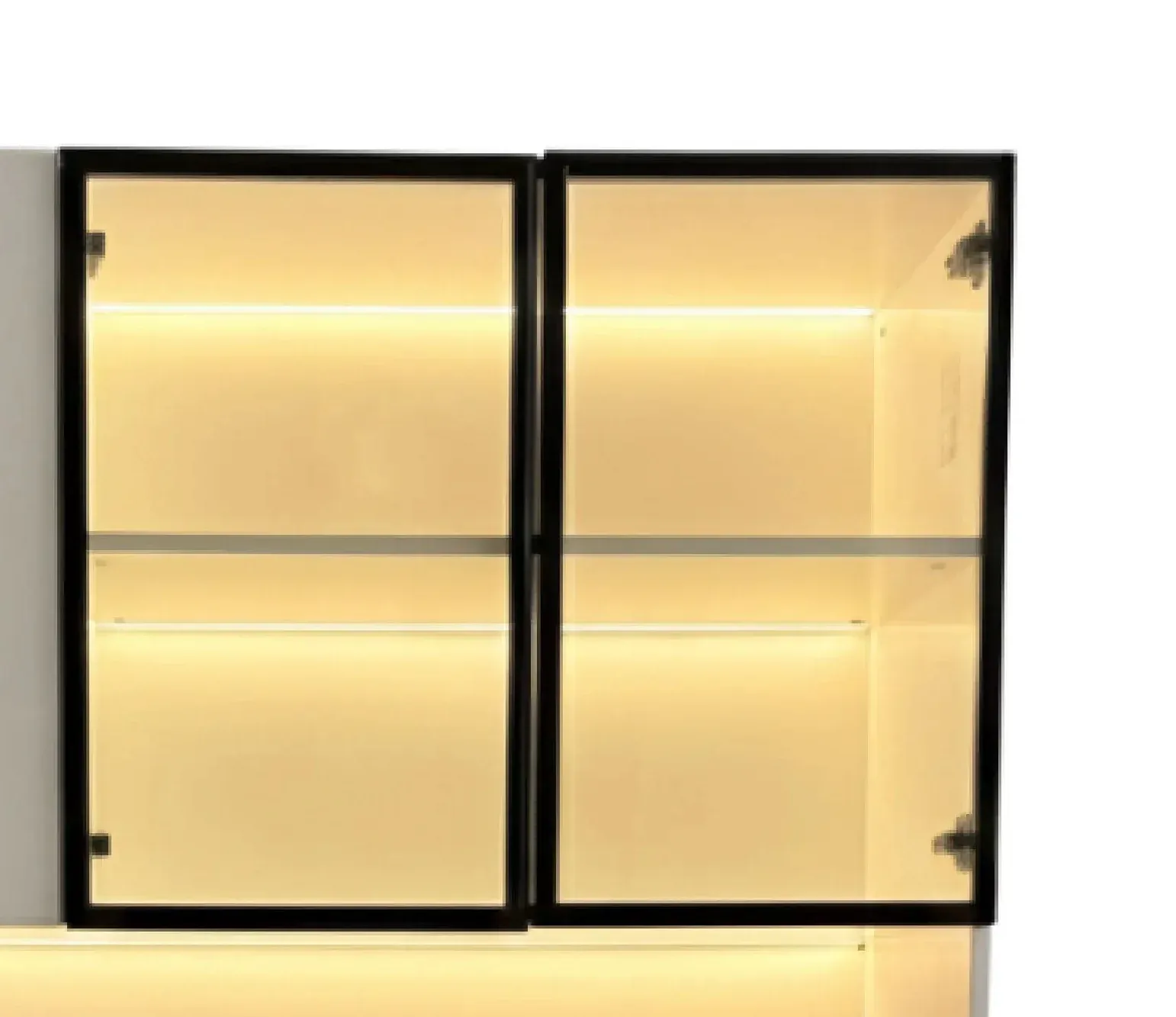 Black-framed tempered glass display doors with warm LED interior lighting