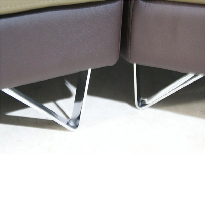 Close-up of a modern chair with metal legs on a light