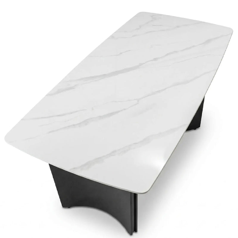 Modern coffee table with white marble-like top and black base on a white background