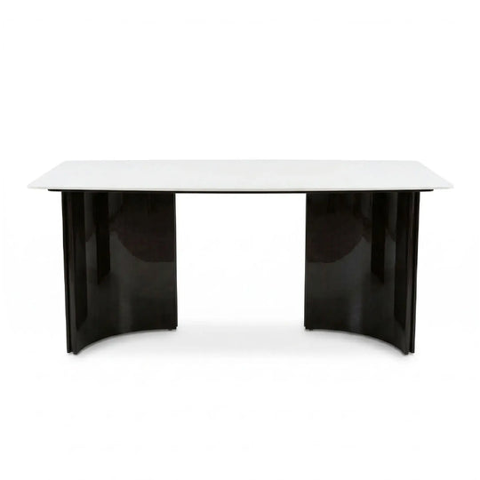 White desk with black legs on a white background