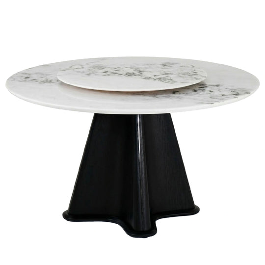 Round table with marble top and black base on a white background