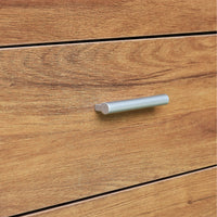Wooden drawer with a metallic handle