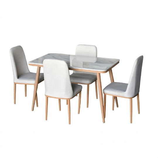 Dining table set with four chairs on a white background