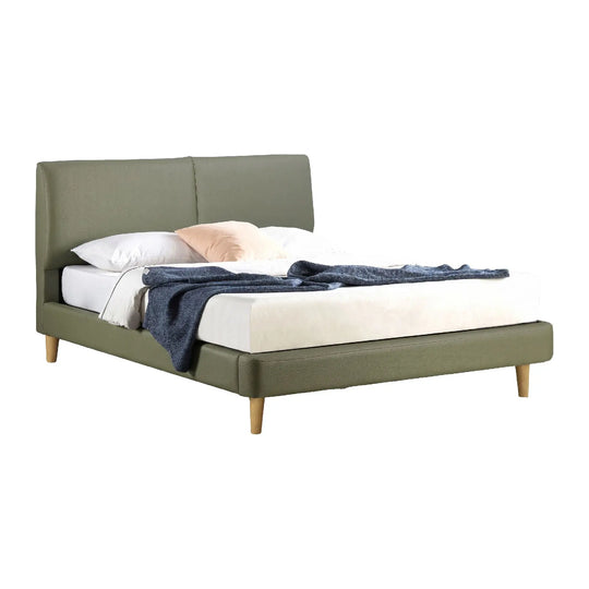 Green bed with white bedding and pillows on a white background
