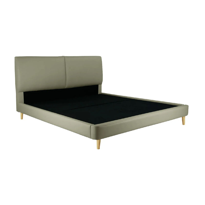 Green upholstered bed with black mattress on a white background