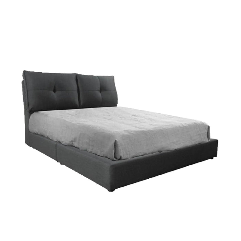 Gray upholstered bed with tufted headboard on a white background