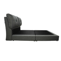 Gray upholstered bed with tufted headboard on a white background