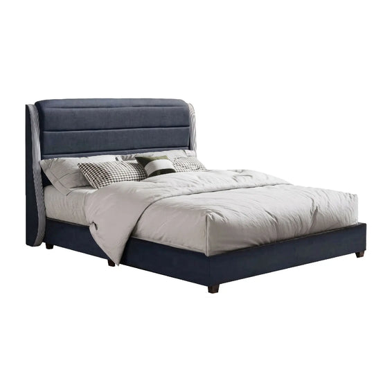 Bed with gray upholstered headboard and white bedding on a white background