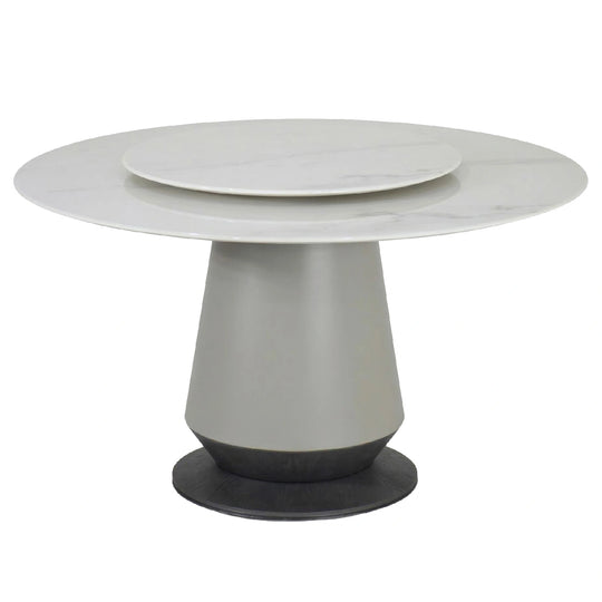 Modern round dining table with a white top and gray base on a white background