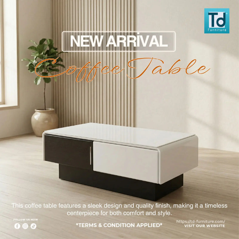 White and black coffee table in a room with a plant and curtains, featuring 'T&F Furniture' branding.