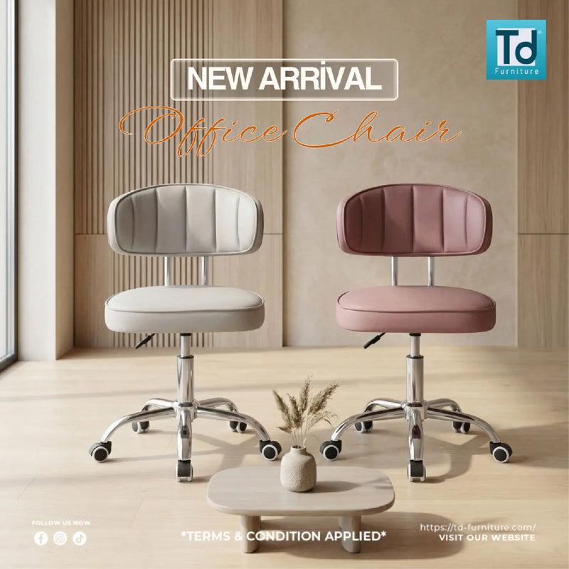 Two office chairs, one gray and one pink, on a wooden floor with a neutral wall background.