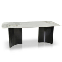 Modern coffee table with marble top and black base on a white background