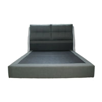 Gray upholstered bed with tufted headboard on a white background