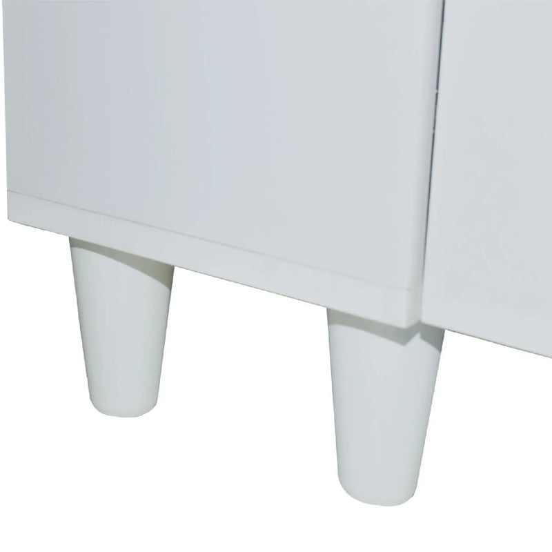 Close-up of a white cabinet with rounded legs on a white background