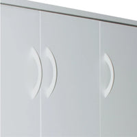 Close-up of a white wardrobe with curved handles on a white background