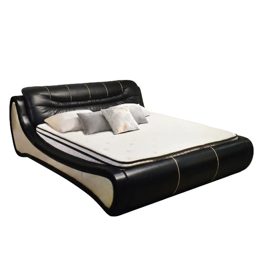 Black and white bed with pillows on a white background