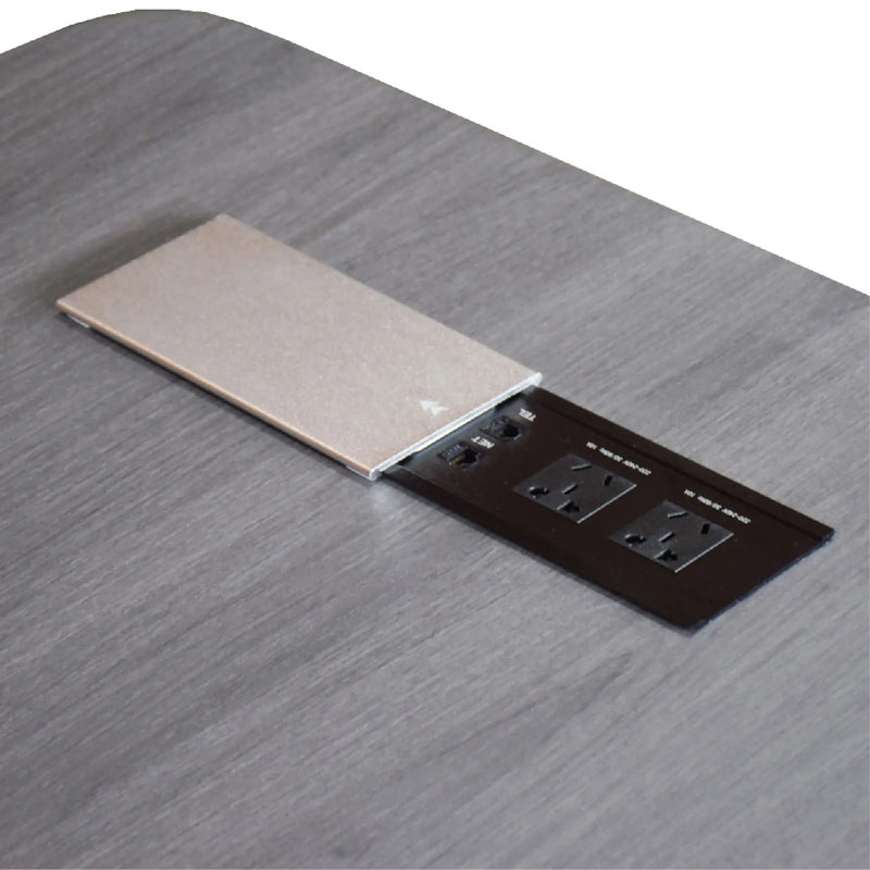 Two electrical outlets on a wooden surface