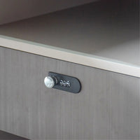 Close-up of a cabinet handle on a wooden surface