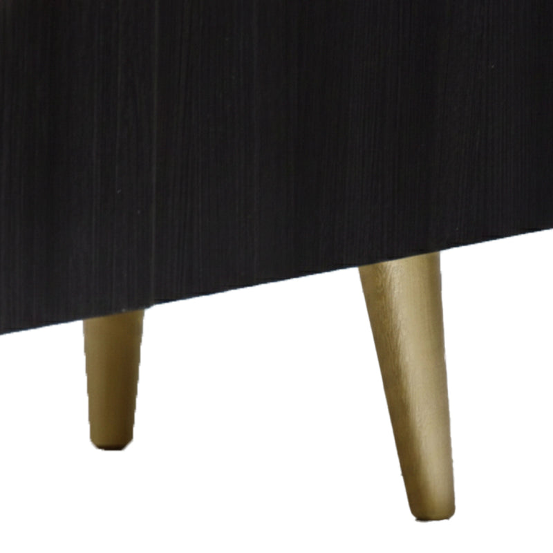 Close-up of a black table with gold legs on a white background