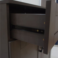 Close-up of a metallic cabinet with an open drawer.