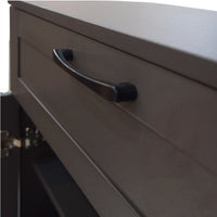 Close-up of a gray drawer with a black handle on a white background